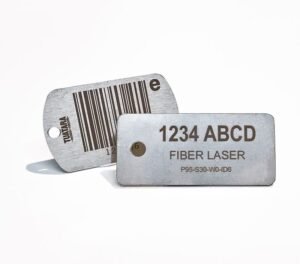 Two stainless steel barcode and identification tags engraved with fiber laser technology, featuring alphanumeric codes and a barcode design.